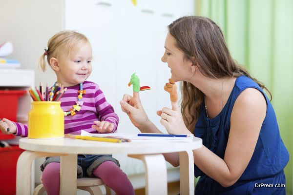 Mother and daughter playing with finger toys