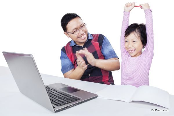 Happy girl with dad and laptop