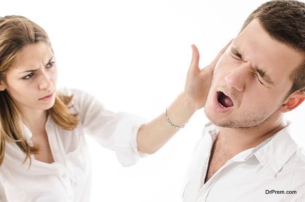 angry young woman slap boyfriend with her hand