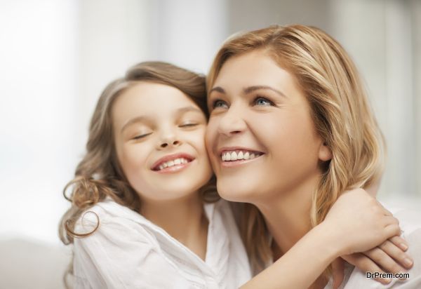 bright picture of hugging mother and daughter