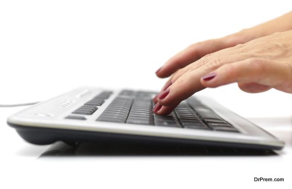 female hands typing on keyboard