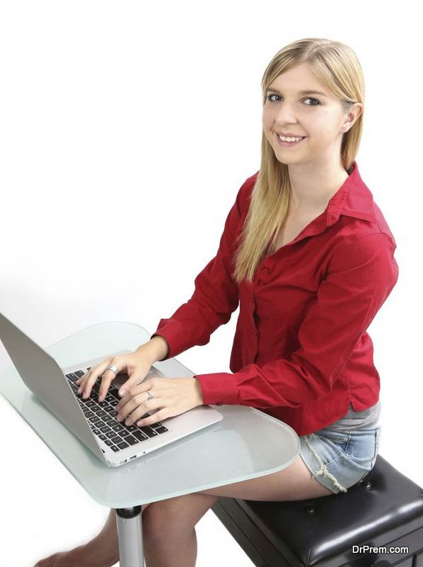 Blonde girl working on a computer